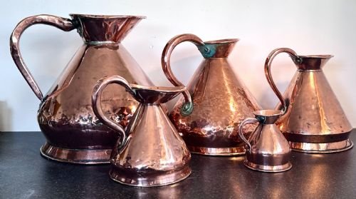 Copper Measuring Jugs of Large Proportion